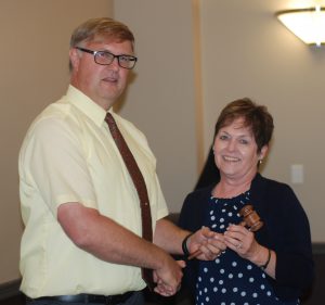 Peterson receiving gavel from Stroeder